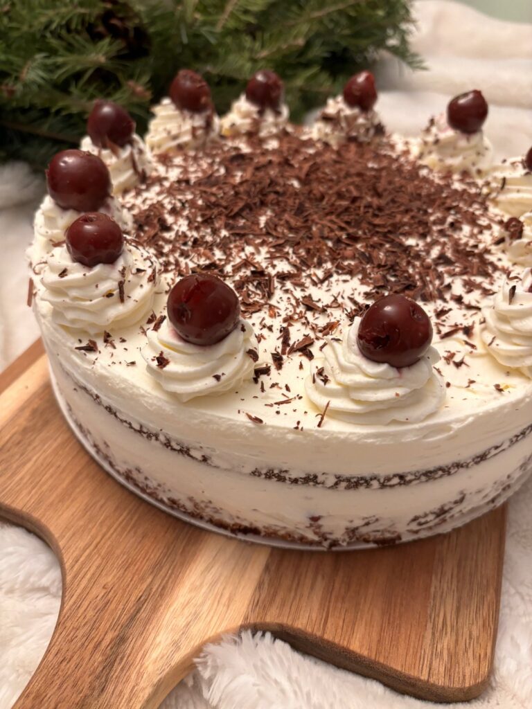 Black Forest cake with cherries and whipped cream.