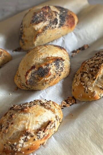 German Bread Rolls on Baguette Tray with Poppyseeds and Sesame Seeds