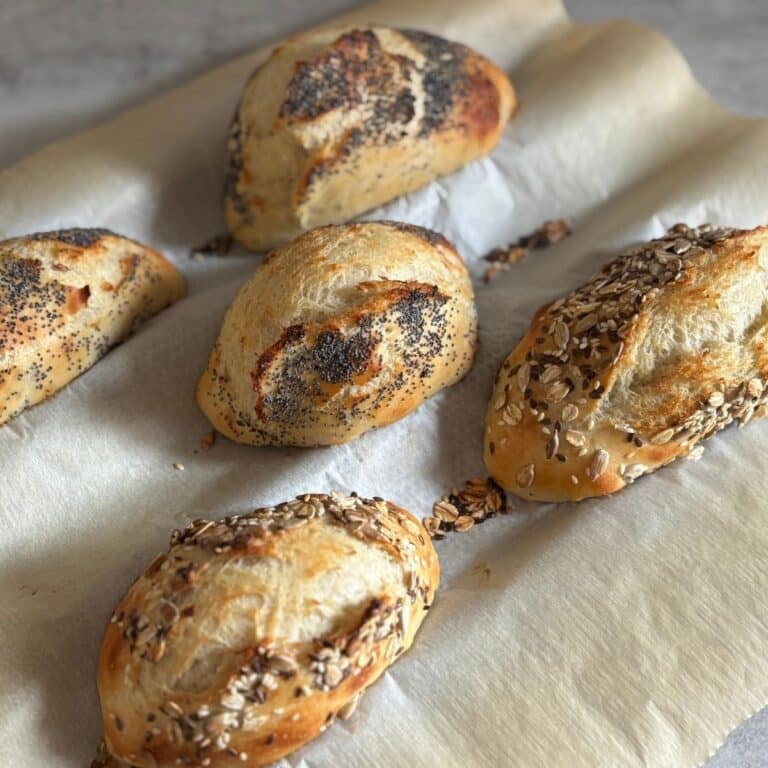 German Bread Rolls on Baguette Tray with Poppyseeds and Sesame Seeds