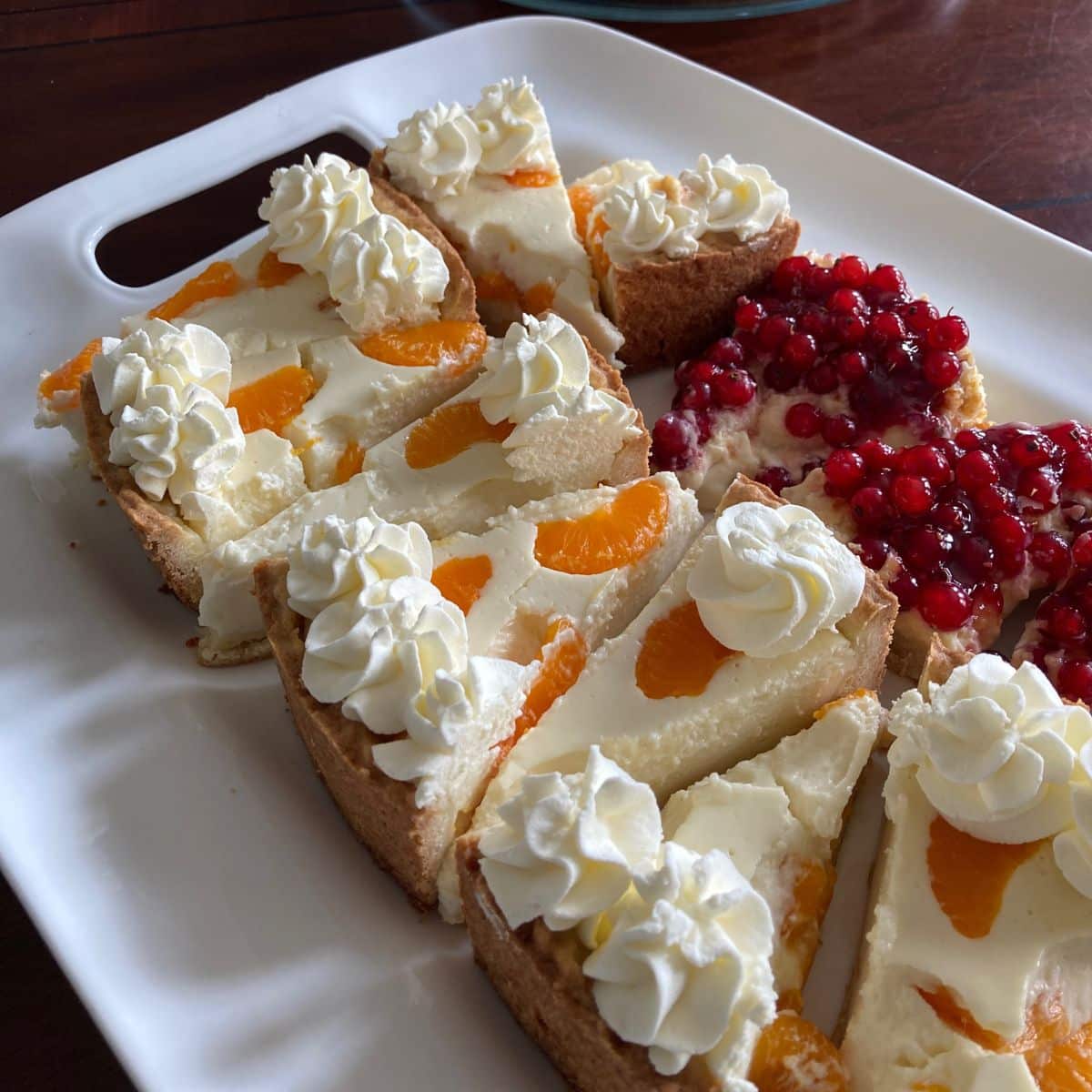 Tray with German Cheesecake and red currant cake