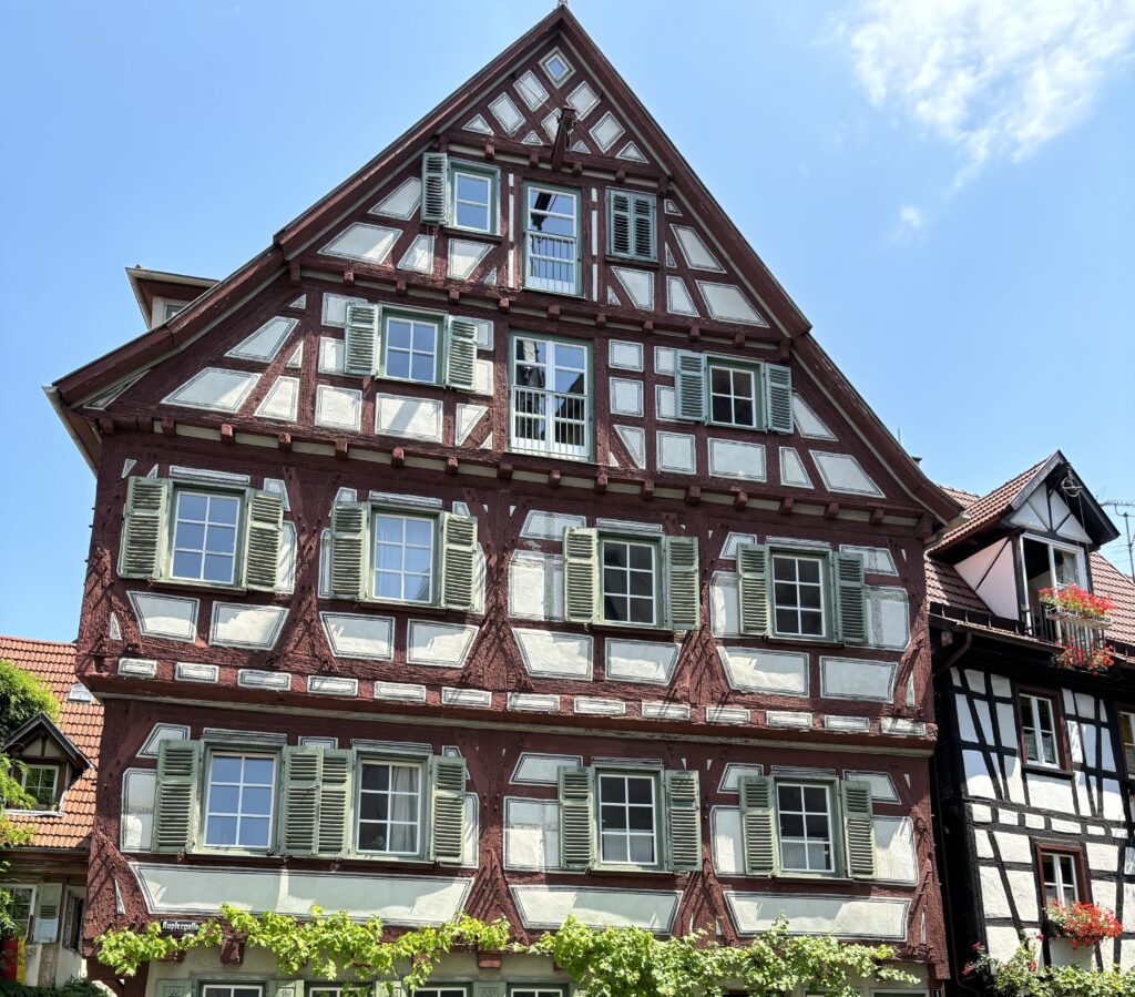 Traditional half-timbered house under blue sky.