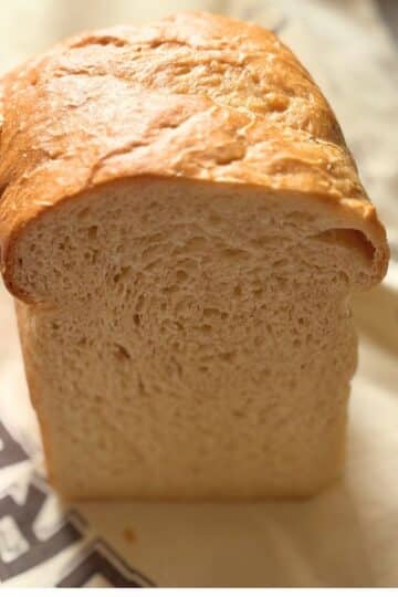 Soft homemade toast bread loaf cut in half