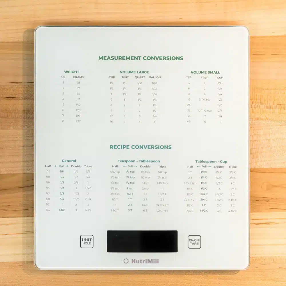 Kitchen scale with measurement conversion chart.