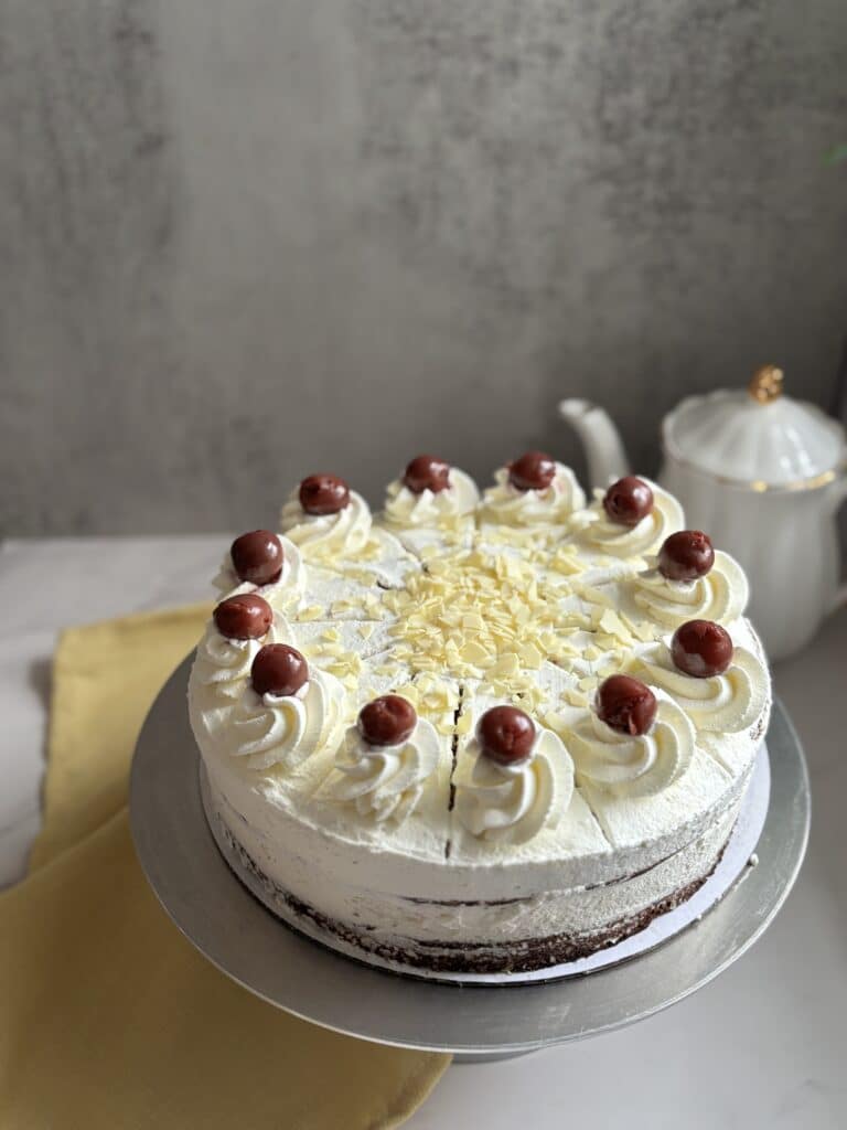 Black Forest cake with cherries and whipped cream.
