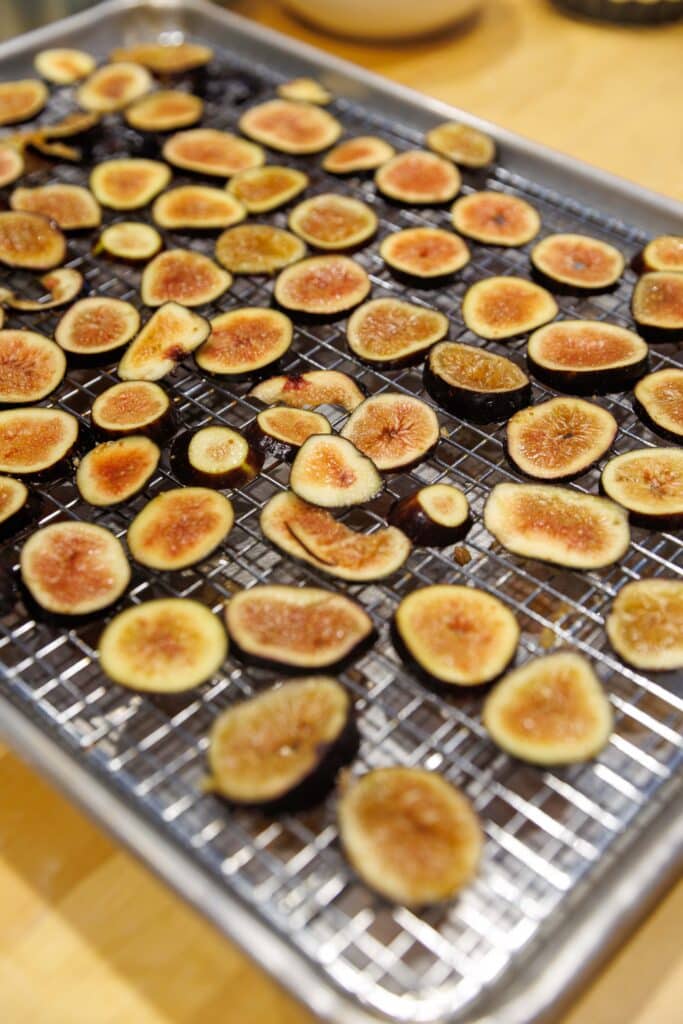 Sliced figs drying on a rack