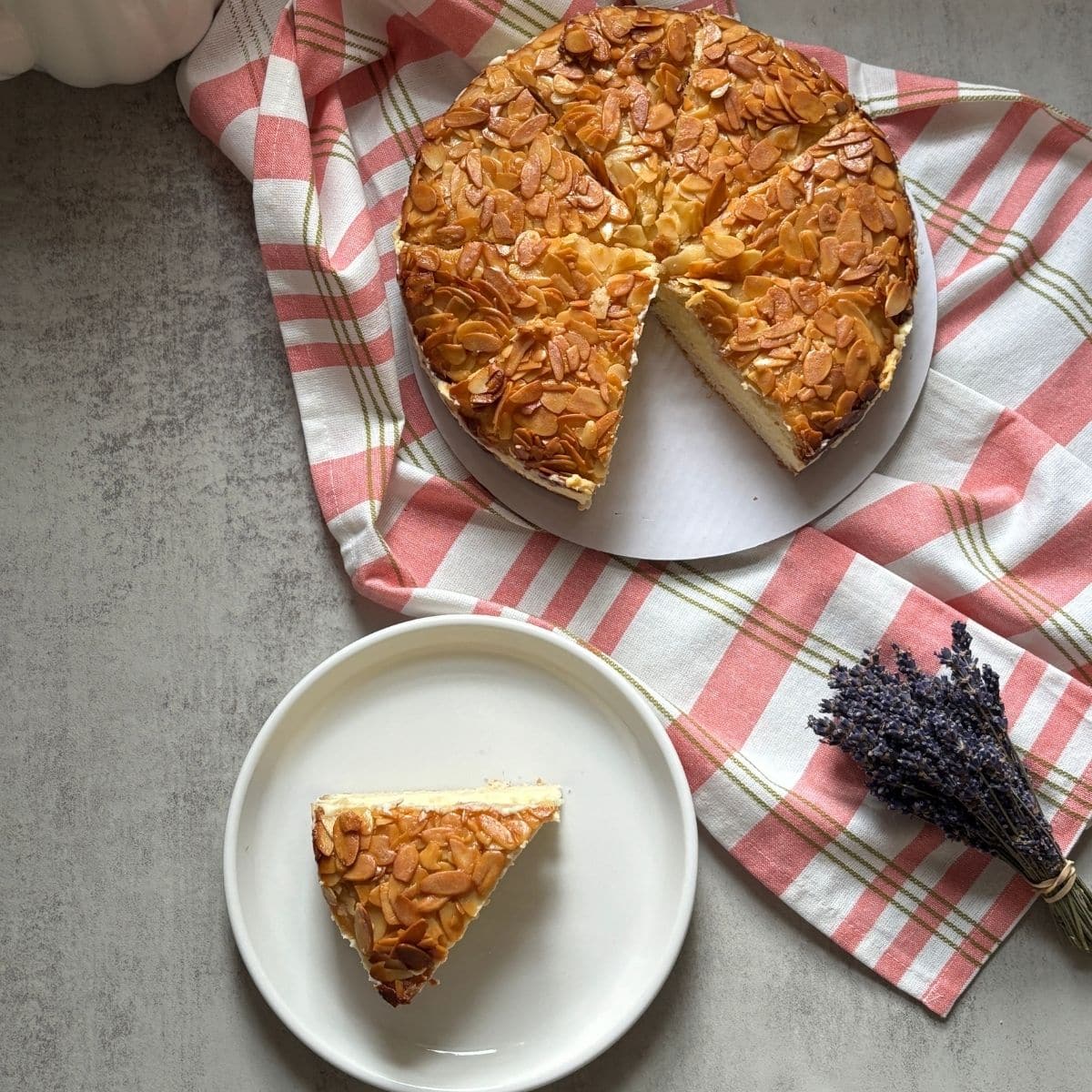 Bee Sting Cake Slice with Almond on a Serving Plate