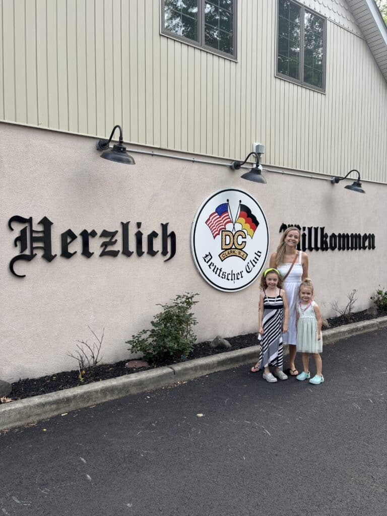 Family posing at German club entrance