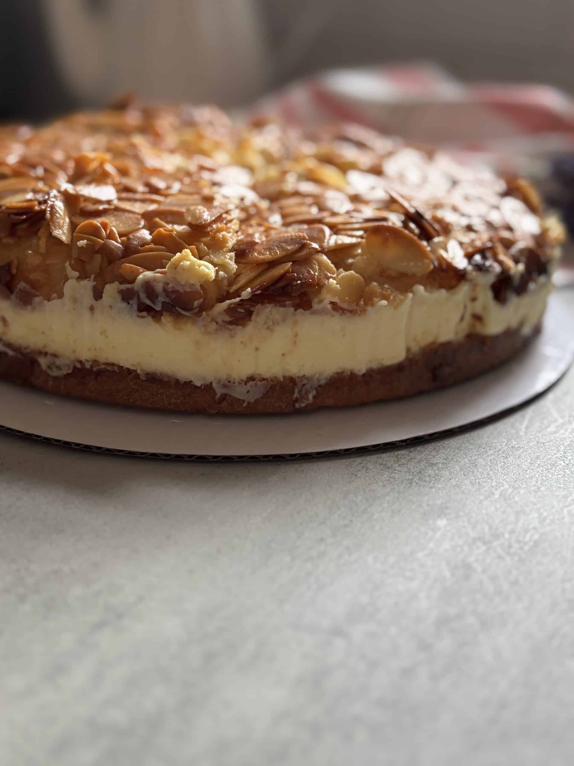 Close-up of almond cream cake on table.