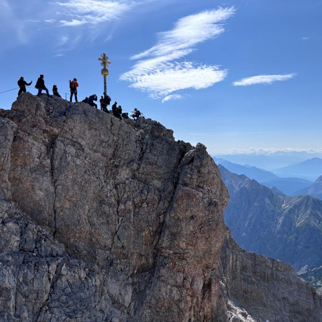 Zugspitze summit cross overlooking the Bavarian Alps on a clear day
