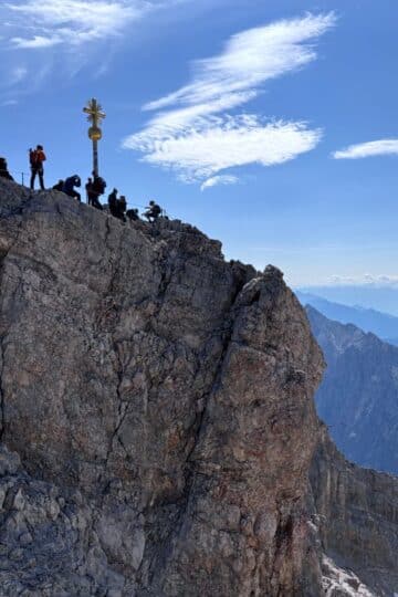 Zugspitze summit cross overlooking the Bavarian Alps on a clear day