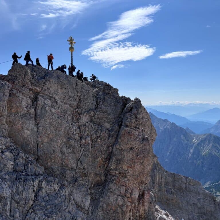 Zugspitze summit cross overlooking the Bavarian Alps on a clear day