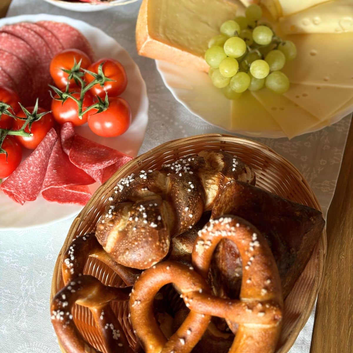 German Breakfast Spread with Pretzels, and Pretzel Rolls, and assorted meat and cheese