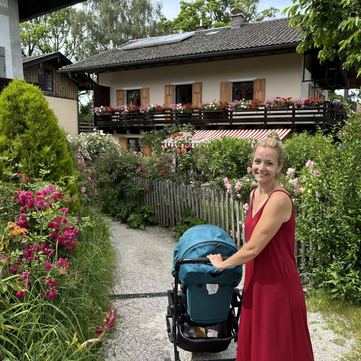 Woman with stroller walking on fraueninsel on lake Chiemsee